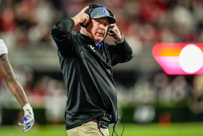 Kentucky Head Coach Mark Stoops walks on the sideline during his team's game against No.1 Georgia in Sanford Stadium.